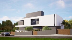 Casa moderna de dois andares com fachada em betão branco e cinzento, janelas amplas e um jardim frontal bem cuidado sob um céu azul.