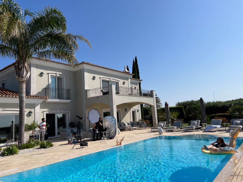 Luxury Mediterranean villa poolside photoshoot on a sunny day