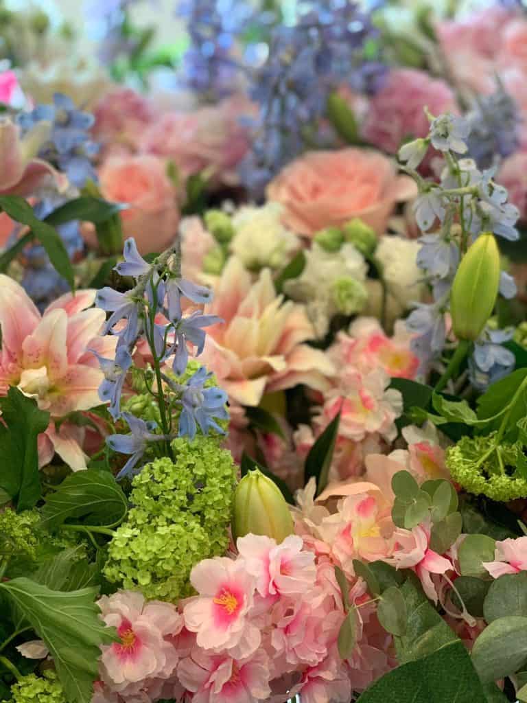 Soft pastel flower arrangement with roses and lilies