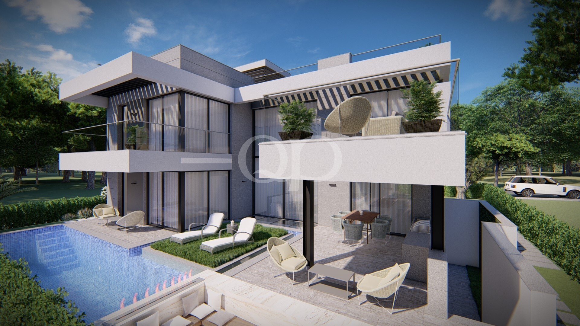 Modern two-story villa with large glass walls, white-gray facade, and a blue tiled pool in the foreground, plus loungers and seating areas outside.