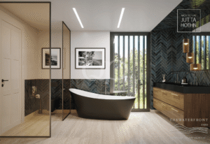 Casa de banho moderna e luxuosa com uma banheira preta independente, uma divisória de duche em vidro, um toucador em madeira, azulejos azuis em espinha, arte emoldurada e uma janela alta.