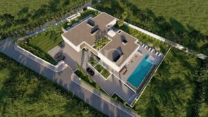 Aerial perspective showcasing the villa, swimming pool and beautifully landscaped grounds