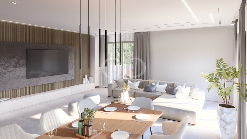 Wohnzimmer mit Akzentwand, Pendelleuchten und raumhohen Fenstern