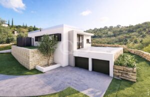 Extérieur d'une villa moderne avec double garage et murs en pierre naturelle