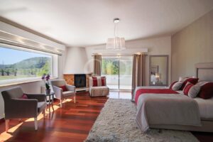 Bedroom with terrace access, wood flooring and spacious sitting area