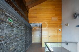 Interior landing with wood and stone detailing
