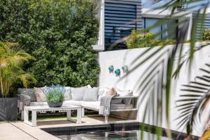 Relaxed outdoor seating surrounded by greenery