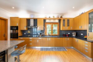 Fully equipped kitchen with granite worktops and garden views