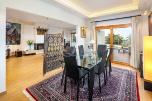 Dining area with terrace access and feature tiled partition