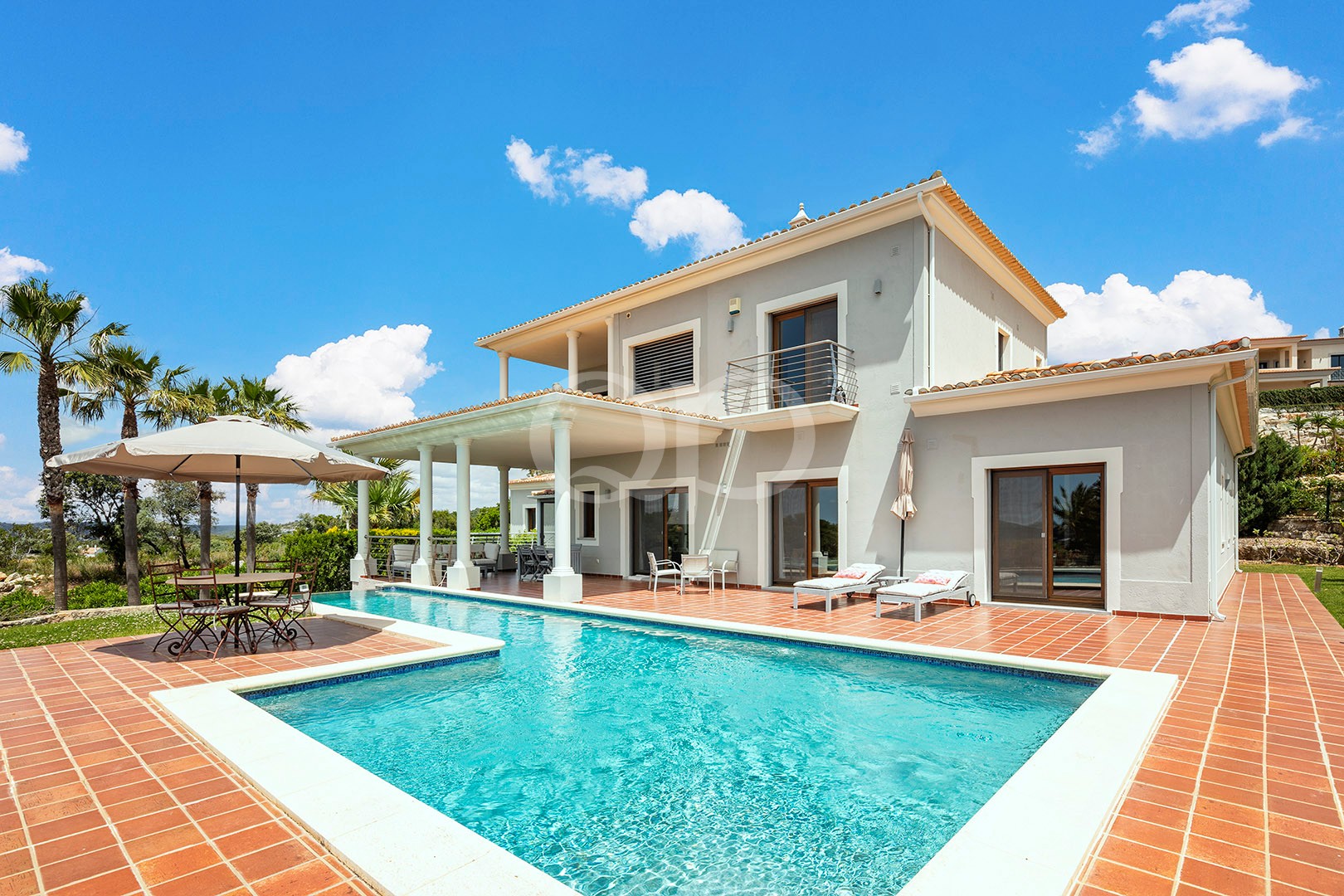 Villa exterior with private swimming pool and covered terrace