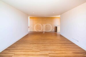Open plan living and dining area with wood flooring