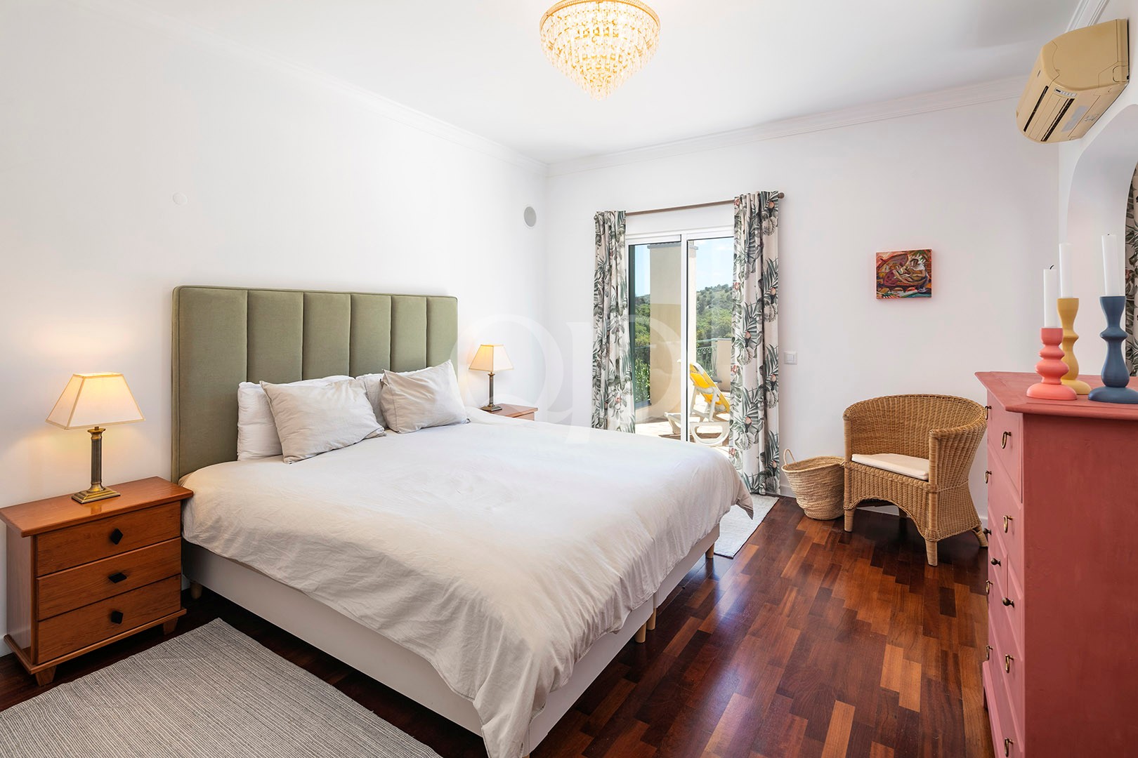 Bedroom with fitted headboard and terrace access