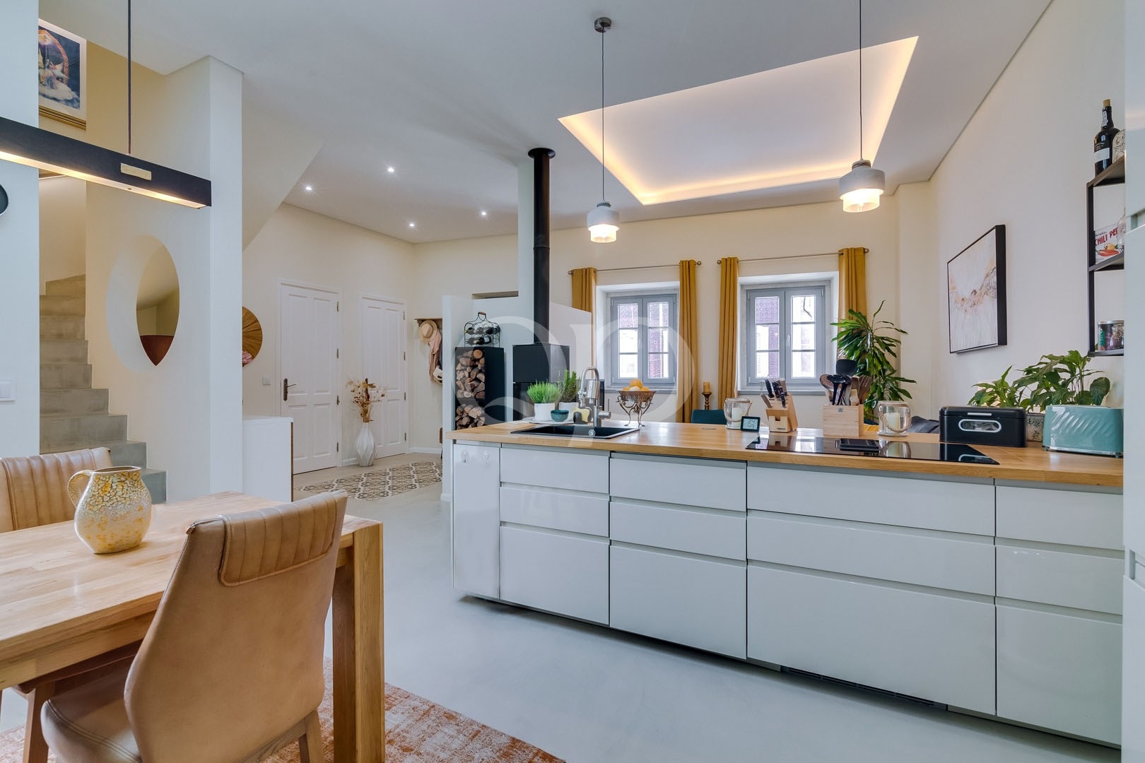 Contemporary kitchen with island, pendant lighting and traditional windows