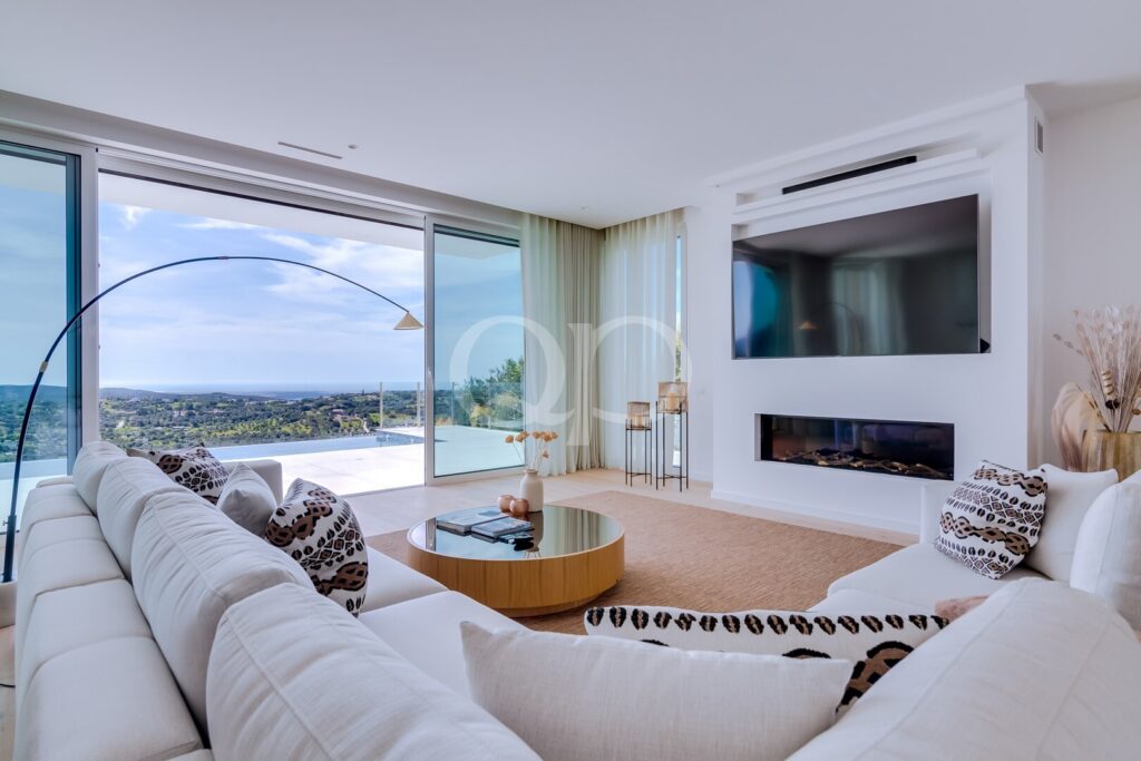 Bright luxury villa living room with panoramic sea views and contemporary interiors.