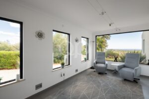 Sitting area with large windows and countryside views