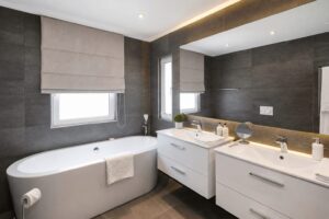 Bathroom with bathtub and double vanity