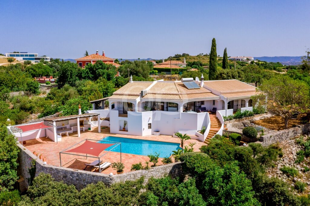 Traditional Mediterranean villa with dazzling blue pool and countryside views