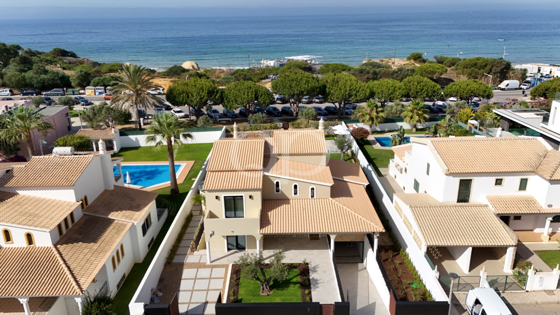 Aerial view of villa with private grounds and nearby coastline