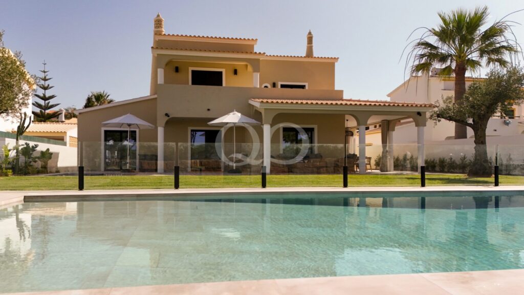Elegant villa exterior with private swimming pool and covered terrace