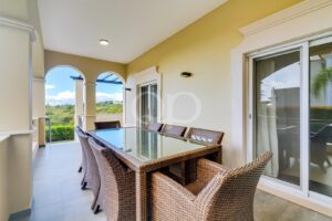 Spacious balcony area overlooking lush greenery, fit for entertaining