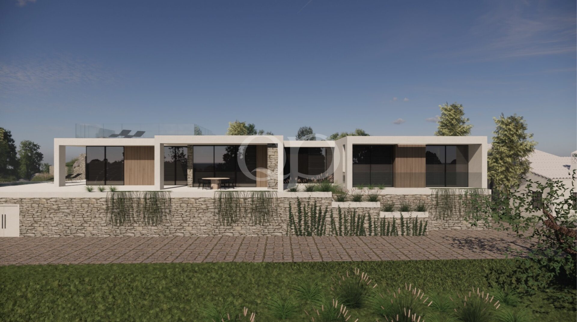 Moderne Villa mit Steinmauern und landschaftlich gestalteter Fassade