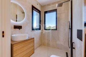 Bathroom with walk in shower, timber vanity and large window