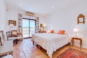 Bright, spacious bedroom with gorgeous Mediterranean tiling and direct access to a terrace