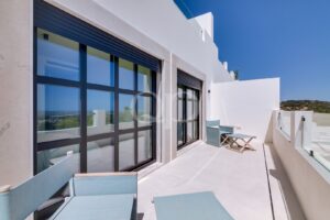 Terrace with black framed windows and open views