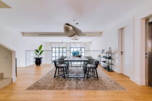 Dining room with large windows and contemporary pendant lighting