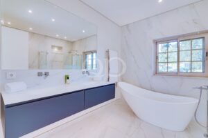 Bright bathroom with freestanding bath