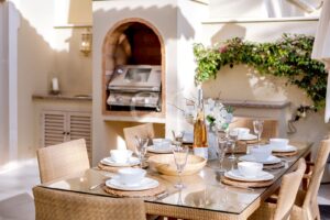 Outdoor dining area with built in barbecue