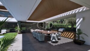 Open-plan modern covered terrace and outdoor BBQ area overlooking a landscaped garden