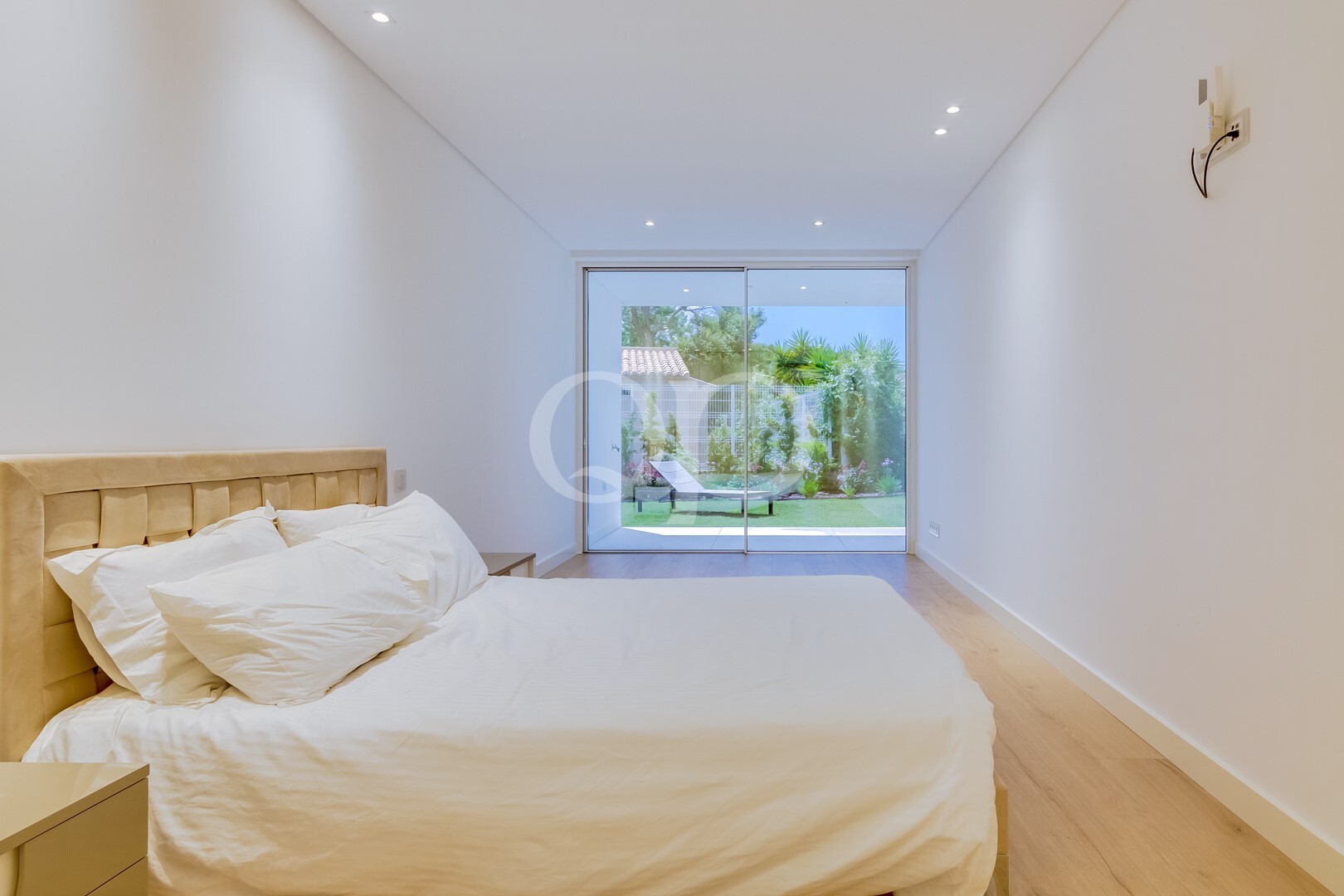 Bedroom with direct garden access and floor to ceiling glazing