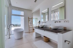 Elegant ensuite bathroom with double vanity, freestanding bathtub and contemporary finishes.