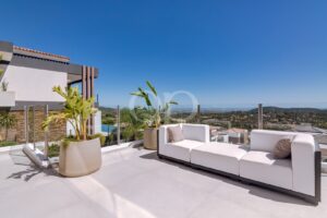 Spacious outdoor terrace with comfortable seating and panoramic Algarve countryside views.