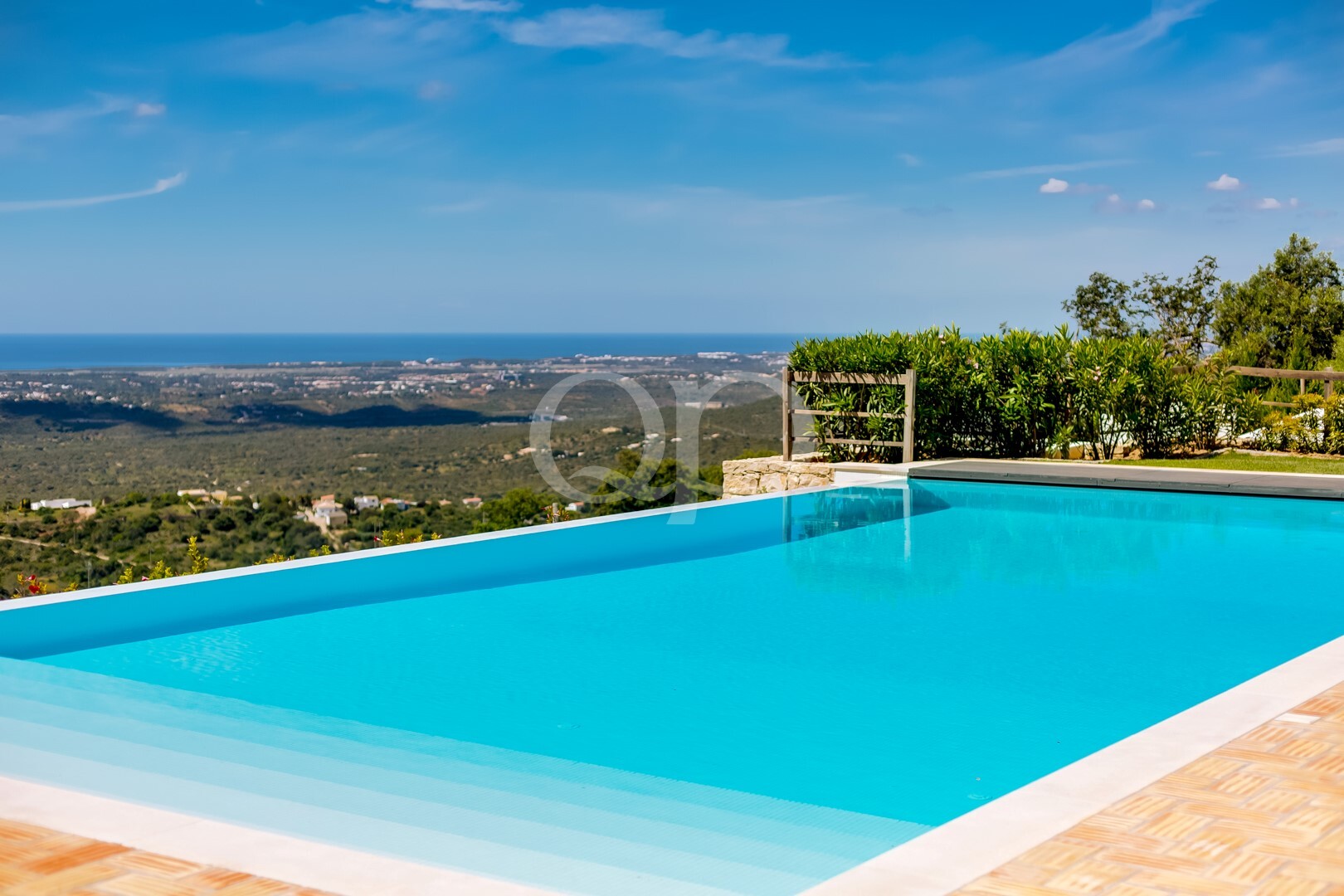 Luxurious infinity pool with panoramic countryside and sea views
