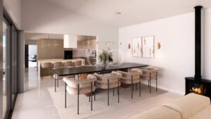 Salle à manger ouverte sur la cuisine, avec îlot central et éclairage décoratif