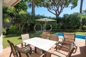 Outdoor dining area with swimming pool
