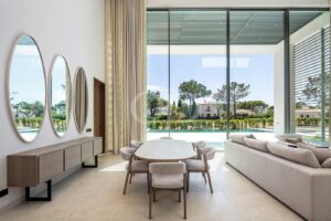 Elegant dining area overlooking swimming pool