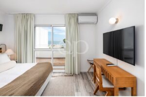 Bedroom with balcony access and sea views