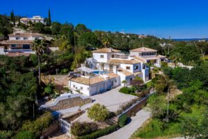 Aerial view of traditional Algarve villa with private swimming pool
