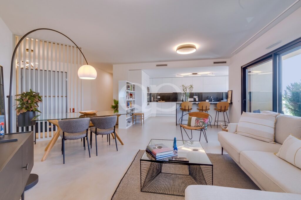 Open-plan living and dining area with contemporary fully fitted kitchen