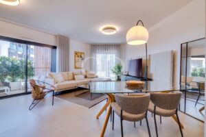 Bright open-plan living area with terrace access and contemporary interiors