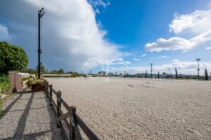 Spacious outdoor equestrian riding arena with views of the Algarve countryside