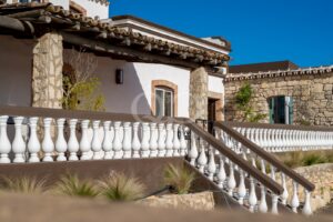 Traditional Algarve estate architecture with white balustrades and stone detailing