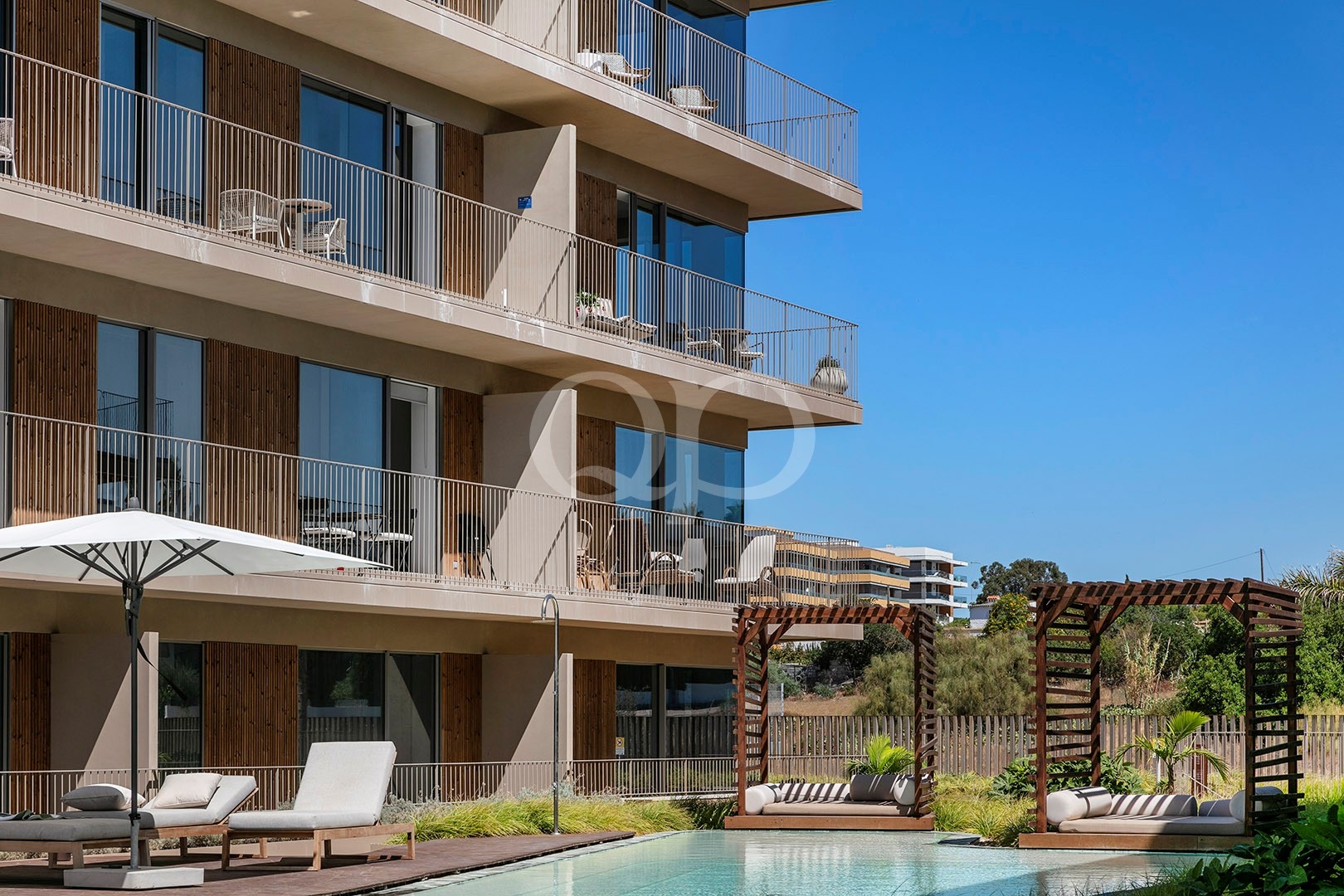 Contemporary apartment building with private balconies and modern architecture