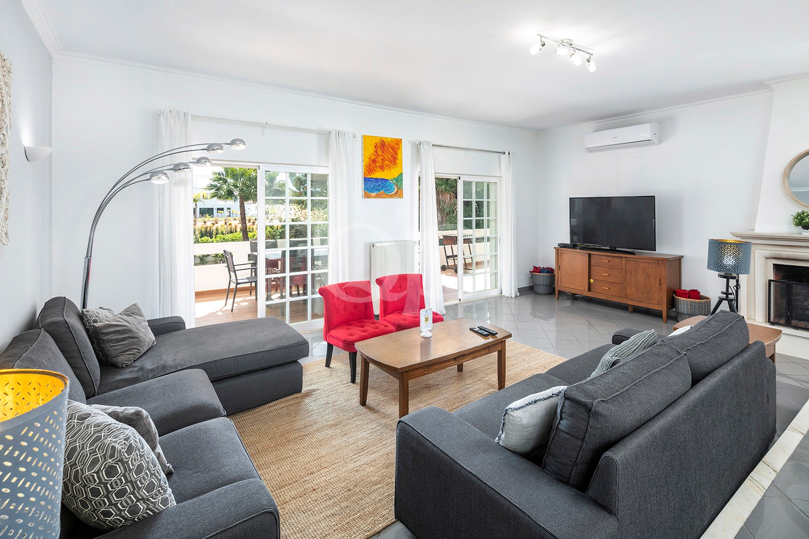 Sitting room with TV and terrace access