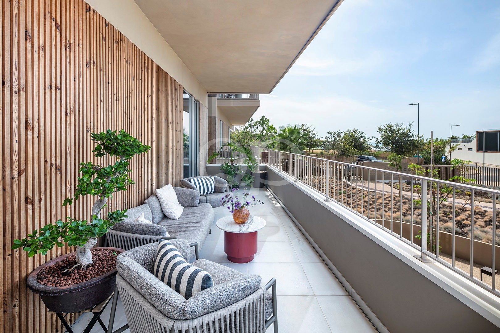 Spacious private balcony with comfortable seating and outdoor living area
