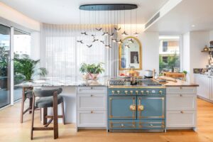 Stylish fitted kitchen with distinctive island and contemporary finishes